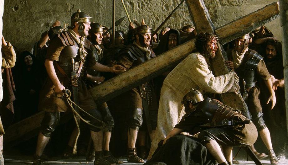 SCENE FROM MOVIE ‘THE PASSION OF THE CHRIST’ Jim Caviezel portrays Christ with his cross in a scene from the movie "The Passion of the Christ." The film, produced and directed by Mel Gibson, is a vivid depiction of the last hours of the life of Jesus. It received an R rating from the Motion Picture Association of America for sequences of graphic violence. (CNS photo from Icon Productions) (Feb. 24, 2004) See MOVIE REVIEW to come.